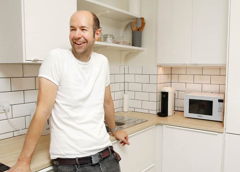 Man standing in kitchen