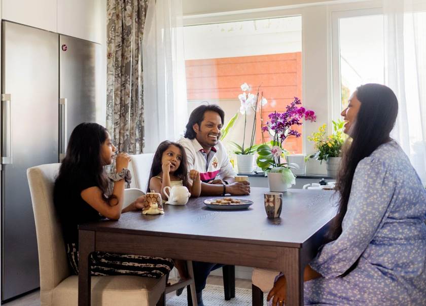 family sat at dining table