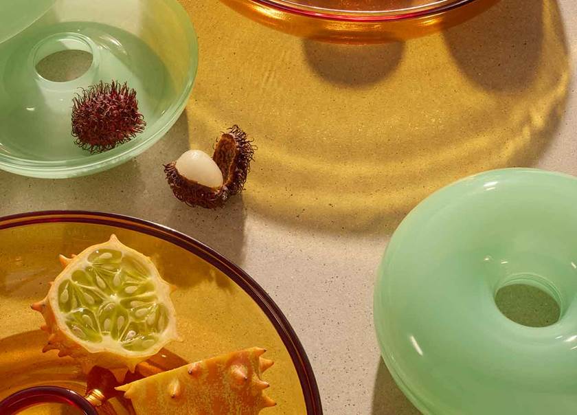 Glass bowls in green, yellow and orange