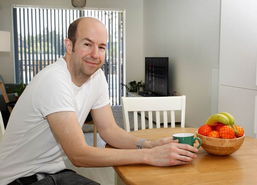 Man sat at kitchen table