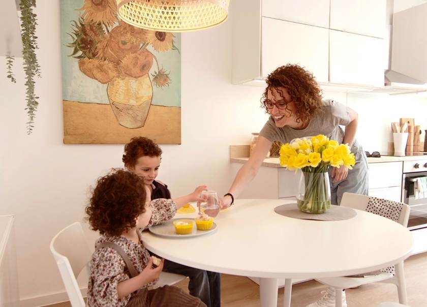 Children sat at white kitchen table