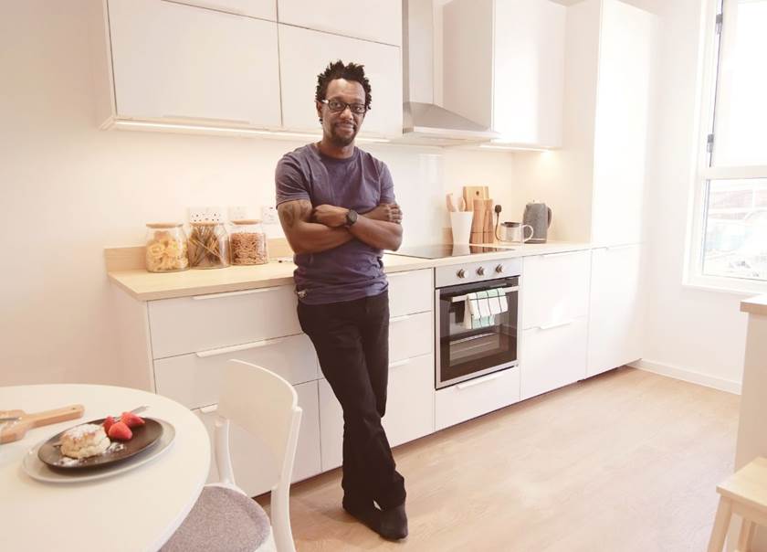 man standing in kitchen